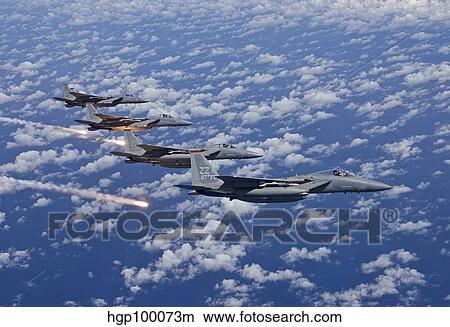 Four F-15 Eagles fly in formation over the Pacific Ocean. View Large Photo Image Picture - Four F-15 Eagles fly in formation over the Pacific Ocean.. Fotosearch