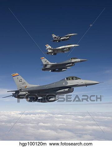 Four F-16's fly in formation during a training mission over Arizona. View Large Photo Image Picture - Four F-16's fly in formation during a training mission over Arizona.. Fotosearch