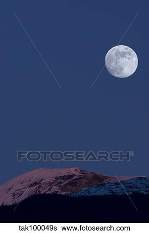 Full Moon at Alpenglow. View Large Photo Image Stock Photograph - Full Moon at Alpenglow.. Fotosearch