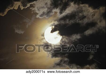 Full moon in clouds, Gleichen, Alberta, Canada. View Large Photo Image Stock Photograph - Full moon in clouds, Gleichen, Alberta, Canada.. Fotosearch