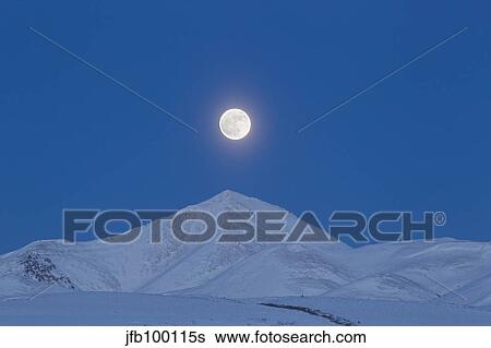 Full moon over Ogilvie Mountains, Canada. View Large Photo Image Stock Photograph - Full moon over Ogilvie Mountains, Canada.. Fotosearch