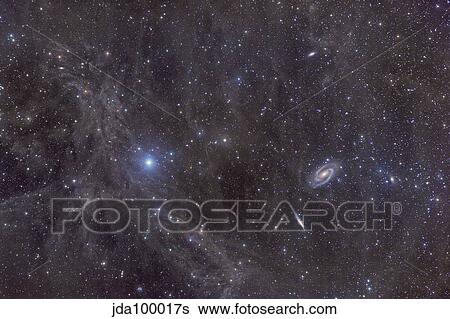 Galaxies M81 and M82 as seen through the Intergalactic Flux Nebula. View Large Photo Image Stock Photograph - Galaxies M81 and M82 as seen through the Intergalactic Flux Nebula.. Fotosearch