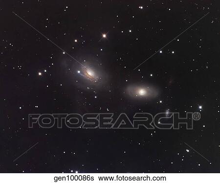 Galaxies NGC 3166 and NGC 3169 in the constellation Sextans. View Large Photo Image Stock Photograph - Galaxies NGC 3166 and NGC 3169 in the constellation Sextans.. Fotosearch