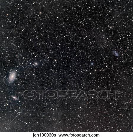 Galaxies surrounded by interstellar dust. View Large Photo Image Stock Photograph - Galaxies surrounded by interstellar dust.. Fotosearch