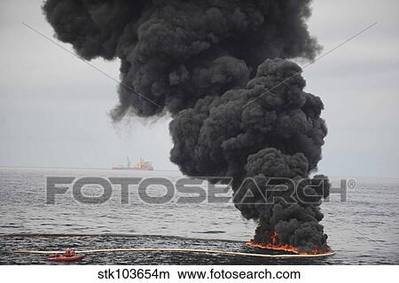 Gathered concentrated oil burns during a controlled oil fire in the Gulf of Mexico. View Large Photo Image Picture - Gathered concentrated oil burns during a controlled oil fire in the Gulf of Mexico.. Fotosearch