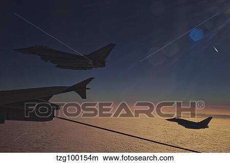 German Air Force Eurofighter Typhoon aircraft refueling over France. View Large Photo Image Picture - German Air Force Eurofighter Typhoon aircraft refueling over France.. Fotosearch