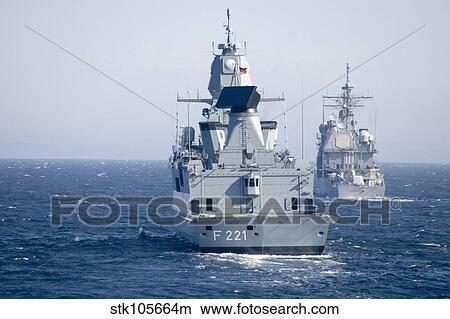 German frigate FFG Hessen and USS Normandy off the coast of Scotland. View Large Photo Image Picture - German frigate FFG Hessen and USS Normandy off the coast of Scotland.. Fotosearch