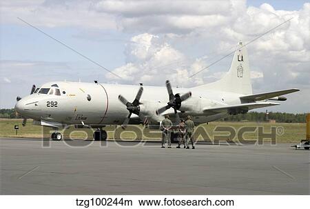 Picture - German ground crew members observe a P-3C Orion of the U. S. Navy.. Fotosearch