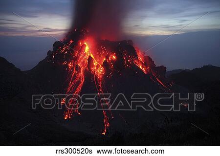 Stock Photograph - Glowing Rerombola lava dome of Paluweh volcano, Indonesia.. Fotosearch