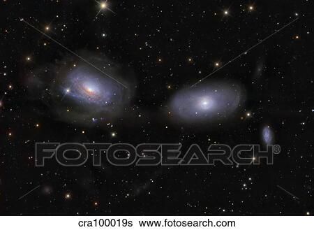 Gravitionaly distorted Galaxies NGC 3169 and NGC 3166. View Large Photo Image Stock Photograph - Gravitionaly distorted Galaxies NGC 3169 and NGC 3166.. Fotosearch