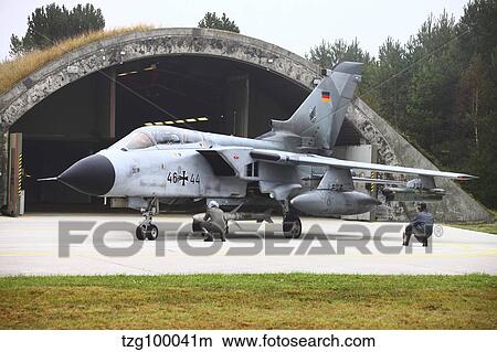 Ground crew conducting pre-flight-checks on a German Tornado ECR. View Large Photo Image Picture - Ground crew conducting pre-flight-checks on a German Tornado ECR.. Fotosearch