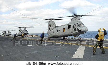 Ground crew prepares CH-46E Sea Knight helicopters for take off. View Large Photo Image Picture - Ground crew prepares CH-46E Sea Knight helicopters for take off.. Fotosearch