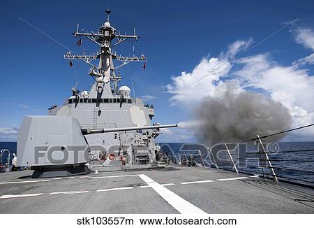 Guided-missile destroyer USS Pinckney fires its MK-45 5-inch/54-caliber gun. View Large Photo Image Picture - Guided-missile destroyer USS Pinckney fires its MK-45 5-inch/54-caliber gun.. Fotosearch