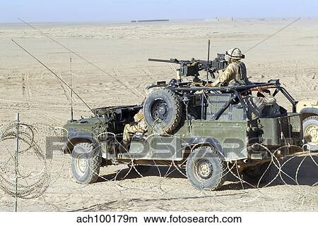 Gurkhas patrol Afghanistan in a Land Rover. View Large Photo Image Picture - Gurkhas patrol Afghanistan in a Land Rover.. Fotosearch