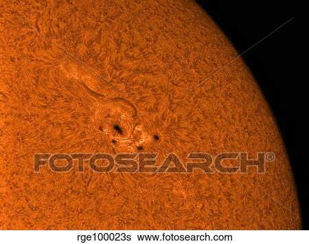 Stock Photograph - H-alpha Sun in orange with active area.. Fotosearch