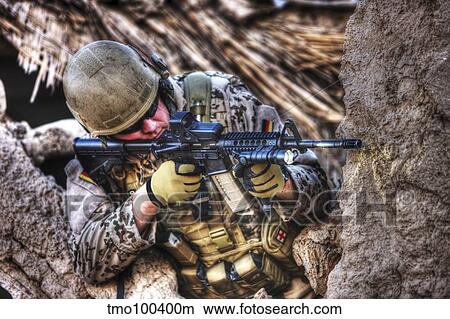 HDR image of a German Army soldier armed with a M4 carbine. View Large Photo Image Picture - HDR image of a German Army soldier armed with a M4 carbine.. Fotosearch