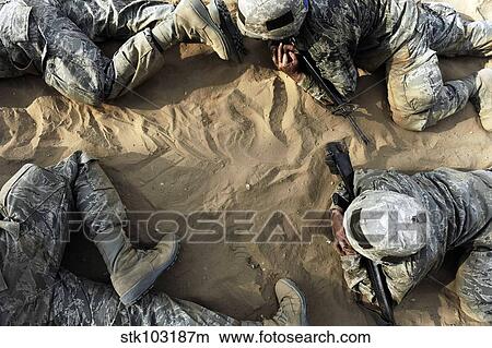 High angle view of Basic trainees crawling through a tactical course. View Large Photo Image Picture - High angle view of Basic trainees crawling through a tactical course. . Fotosearch
