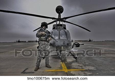 High dynamic range image of a pilot in front of a OH-58D Kiowa. View Large Photo Image Picture - High dynamic range image of a pilot in front of a OH-58D Kiowa.. Fotosearch