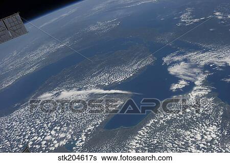 Stock Photograph - High oblique view of Lake Michigan, Lake Huron and the state of Michigan.. Fotosearch