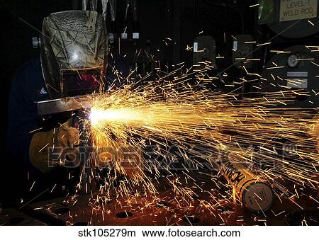 Hull Maintenance Technician welds scrap metal. View Large Photo Image Picture - Hull Maintenance Technician welds scrap metal.. Fotosearch