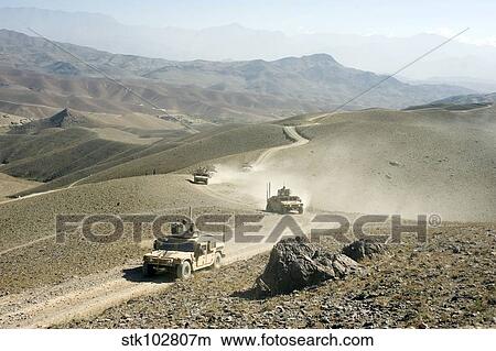 Humvees traverse rugged mountain roads. View Large Photo Image Picture - Humvees traverse rugged mountain roads.. Fotosearch