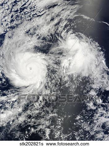 Stock Photograph - Hurricane Felicia and Tropical Storm Enrique east of Hawaii.. Fotosearch