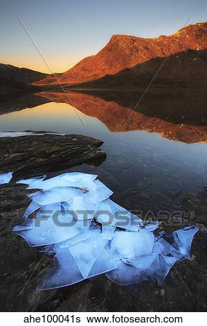 Ice flakes in the shadows of Skittendalen Valley in Troms County, Norway. View Large Photo Image Stock Photograph - Ice flakes in the shadows of Skittendalen Valley in Troms County, Norway.. Fotosearch