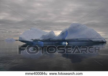 Stock Photograph - Iceberg reflection, Antarctica.. Fotosearch