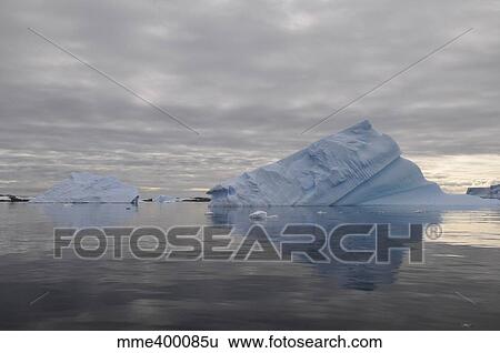 Stock Photograph - Iceberg reflection, Antarctica.. Fotosearch