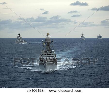 Indian Navy corvette ship INS Kulish leads a group of U. S. Navy ships. View Large Photo Image Picture - Indian Navy corvette ship INS Kulish leads a group of U. S. Navy ships.. Fotosearch