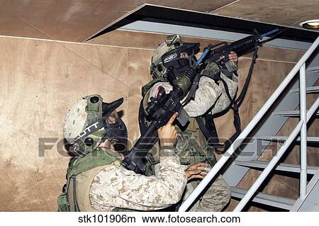 Infantry scouts go up a flight of stairs. View Large Photo Image Picture - Infantry scouts go up a flight of stairs.. Fotosearch