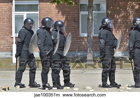 Infantry soldiers of the Belgian Army in riot gear during a training session in Leopoldsburg, Belgium. View Large Photo Image Picture - Infantry soldiers of the Belgian Army in riot gear during a training session in Leopoldsburg, Belgium.. Fotosearch