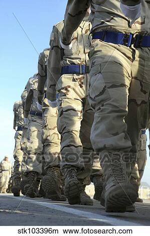 Picture - Iraqi air force recruits march in a pass in review parade during their graduation ceremony.. Fotosearch