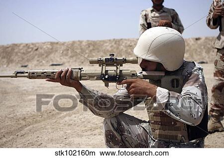 Iraqi Army Sergeant sights in down range during an advanced marksmanship course. View Large Photo Image Picture - Iraqi Army Sergeant sights in down range during an advanced marksmanship course.. Fotosearch