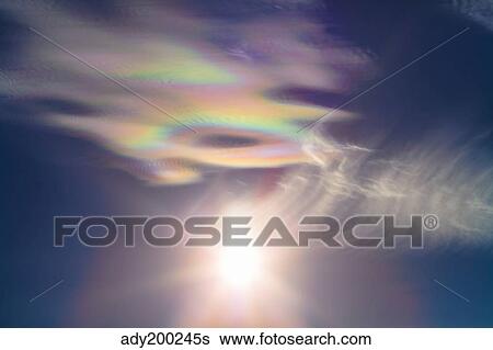 Iridescent clouds near the Sun. View Large Photo Image Stock Photograph - Iridescent clouds near the Sun.. Fotosearch