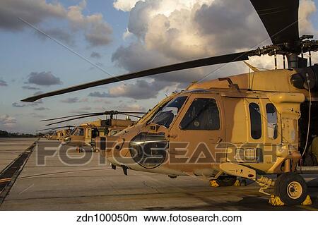 Israeli Air Force UH-60L Yanshuf helicopters parked on the flight line. View Large Photo Image Picture - Israeli Air Force UH-60L Yanshuf helicopters parked on the flight line.. Fotosearch