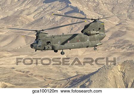 Italian Army CH-47C Chinook helicopter in flight over Afghanistan. View Large Photo Image Picture - Italian Army CH-47C Chinook helicopter in flight over Afghanistan.. Fotosearch