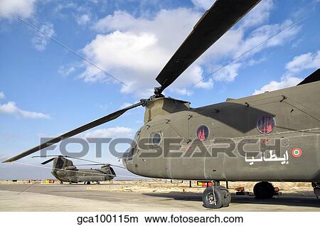 Italian Army CH-47C Chinook helicopters at Forward Operating Base Herat. View Large Photo Image Picture - Italian Army CH-47C Chinook helicopters at Forward Operating Base Herat.. Fotosearch