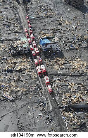 Picture - Japanese fire trucks line a road in this aerial view of Sukuiso, Japan.. Fotosearch