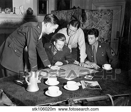 Jedburghs get instructions from briefing officer in London flat, England. View Large Photo Image Picture - Jedburghs get instructions from briefing officer in London flat, England.. Fotosearch