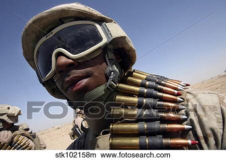 Lance Corporal waits for his turn on the M-2. 50-caliber machine gun. View Large Photo Image Picture - Lance Corporal waits for his turn on the M-2. 50-caliber machine gun.. Fotosearch