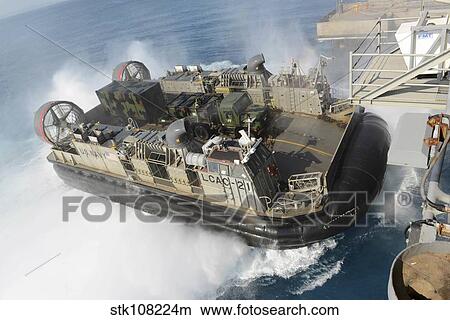 Picture - Landing Craft Air Cushion transfers equipment to USS Bonhomme Richard.. Fotosearch