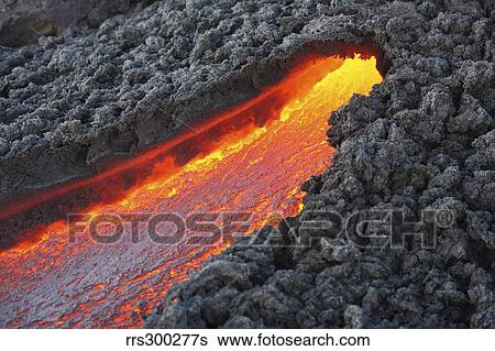 Lava flowing from small tunnel on flank of Pacaya volcano, Guatemala. View Large Photo Image Stock Photograph - Lava flowing from small tunnel on flank of Pacaya volcano, Guatemala.. Fotosearch