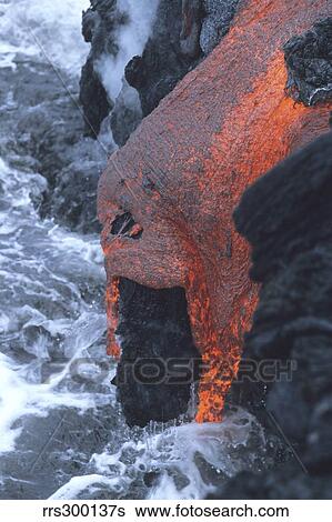 Stock Photograph - Lava flowing into sea, Kilauea volcano, Big Island, Hawaii.. Fotosearch