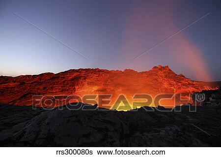Lava lake illuminating walls of pit crater at night, Erta Ale volcano, Danakil Depression, Ethiopia. View Large Photo Image Stock Photograph - Lava lake illuminating walls of pit crater at night, Erta Ale volcano, Danakil Depression, Ethiopia.. Fotosearch