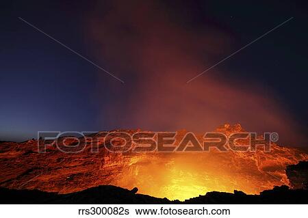 Lava lake illuminating walls of pit crater at night, Erta Ale volcano, Danakil Depression, Ethiopia. View Large Photo Image Stock Photograph - Lava lake illuminating walls of pit crater at night, Erta Ale volcano, Danakil Depression, Ethiopia.. Fotosearch