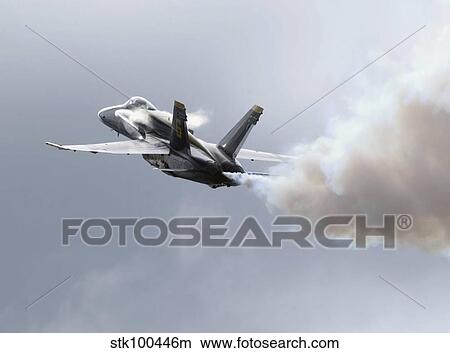 Lead solo pilot of the Blue Angels demonstrates a section high alpha maneuver at an air show. View Large Photo Image Picture - Lead solo pilot of the Blue Angels demonstrates a section high alpha maneuver at an air show.. Fotosearch