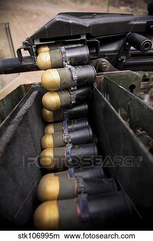 Linked 40mm rounds feed into a Mark 19 grenade launcher. View Large Photo Image Picture - Linked 40mm rounds feed into a Mark 19 grenade launcher.. Fotosearch