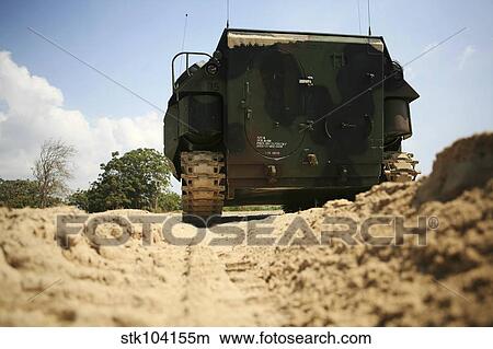 Low angle rear view of an amphibious assault vehicle driving along the beach. View Large Photo Image Picture - Low angle rear view of an amphibious assault vehicle driving along the beach.. Fotosearch