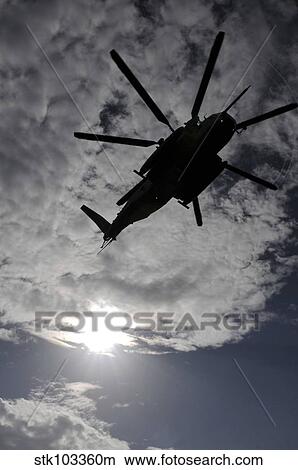 Low angle view of a CH-53E Super Stallion helicopter in flight. View Large Photo Image Picture - Low angle view of a CH-53E Super Stallion helicopter in flight.. Fotosearch